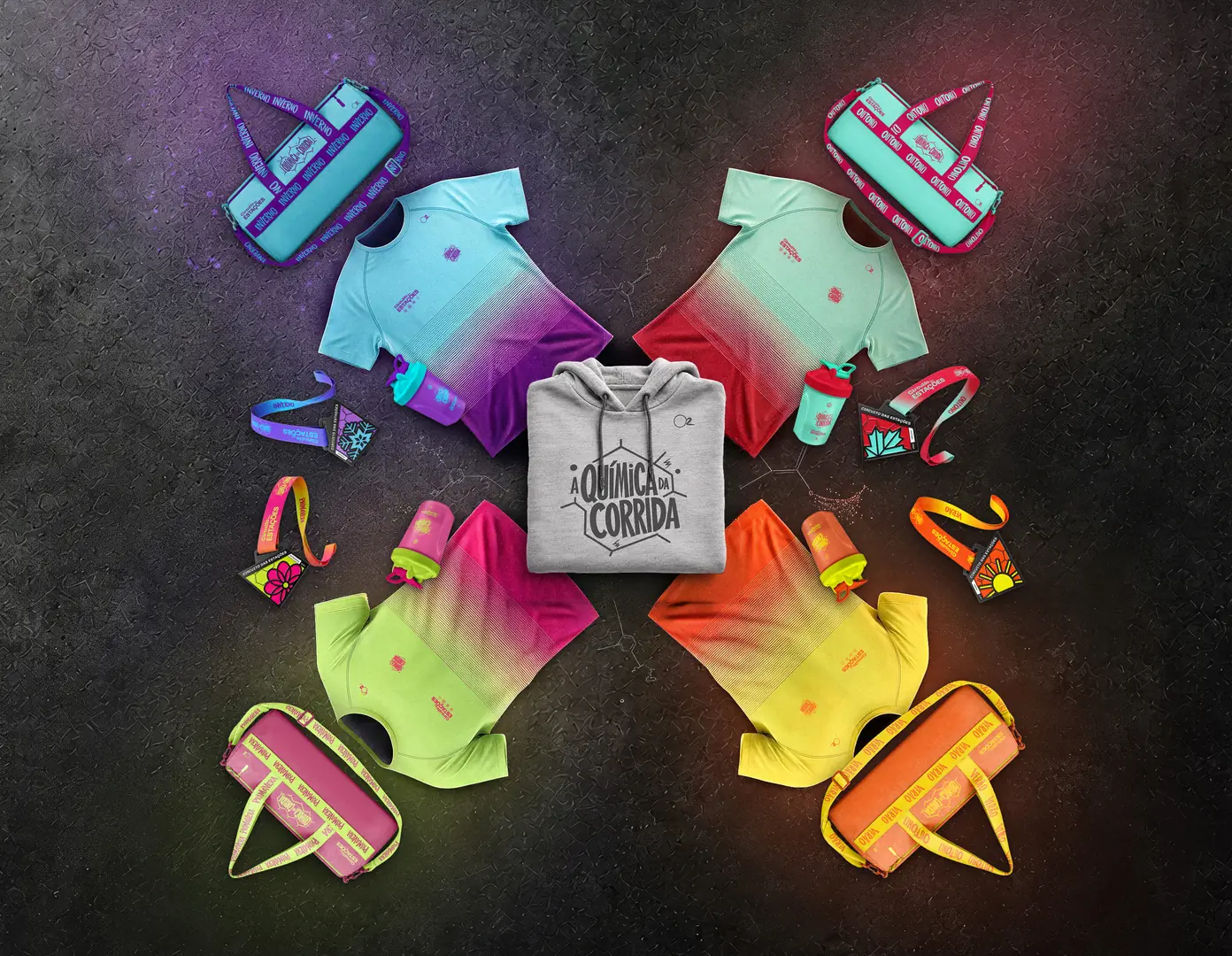 Kit completo do combo: as camisetas, bolsas, garrafas e medalhas das quatro etapas, com o hoodie A Química da Corrida no centro