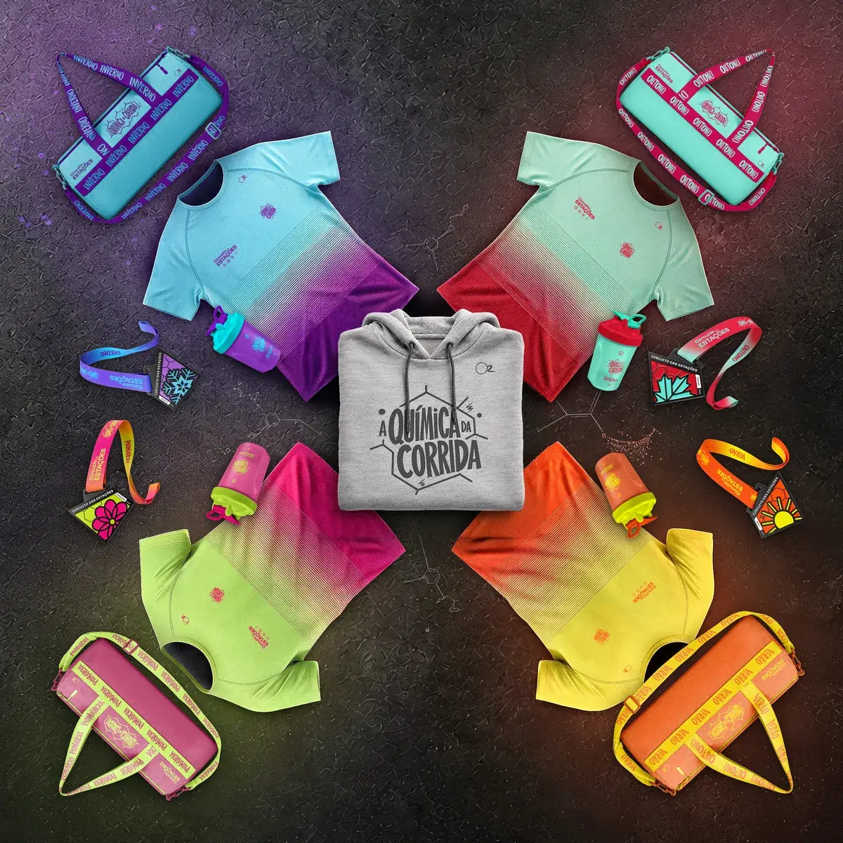 Kit completo do combo: as camisetas, bolsas, garrafas e medalhas das quatro etapas, com o hoodie A Química da Corrida no centro